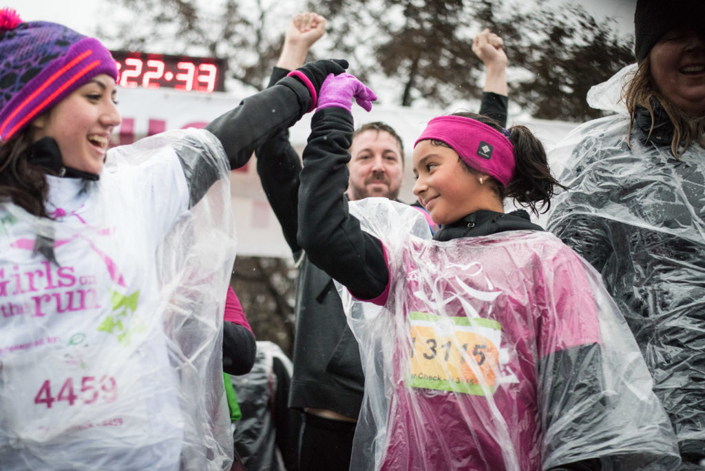 Girls on the Run Chicago high fives at finish line