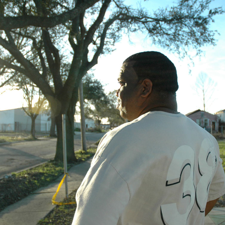 Resident of the Lower Ninth Ward of New Orleans stares into the setting sun.